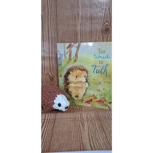 Handmade Crochet Hedgehog Plushie with storybook.